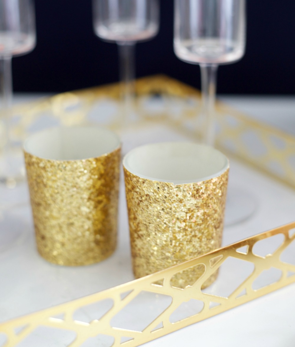 6 Budget-Friendly New Year's Eve Party Ideas by PartiesforPennies.com | Kate Aspen Gold Glitter Votives | Free Printable, NYE, Navy and Pink,